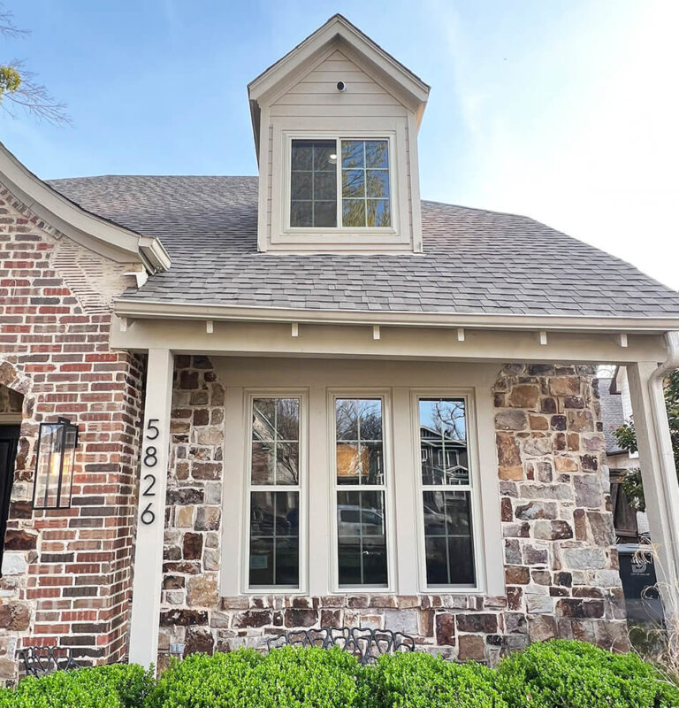 Front of brick house with double-hung windows