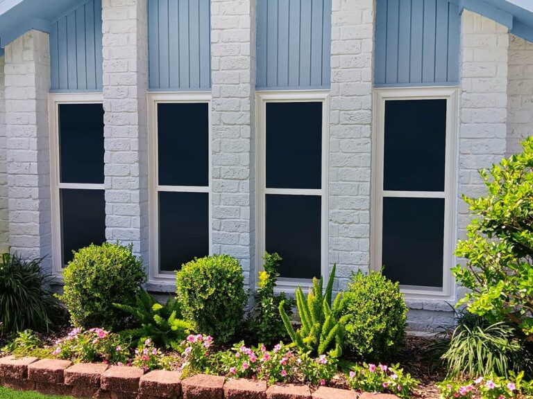 4 windows from the exterior on blue house